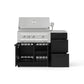 Stainless steel gas grill with open lid, four burners, and modular outdoor kitchen storage units.