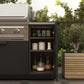 Premium modular outdoor kitchen grill with open cabinet, beside potted plant, on a tiled patio.