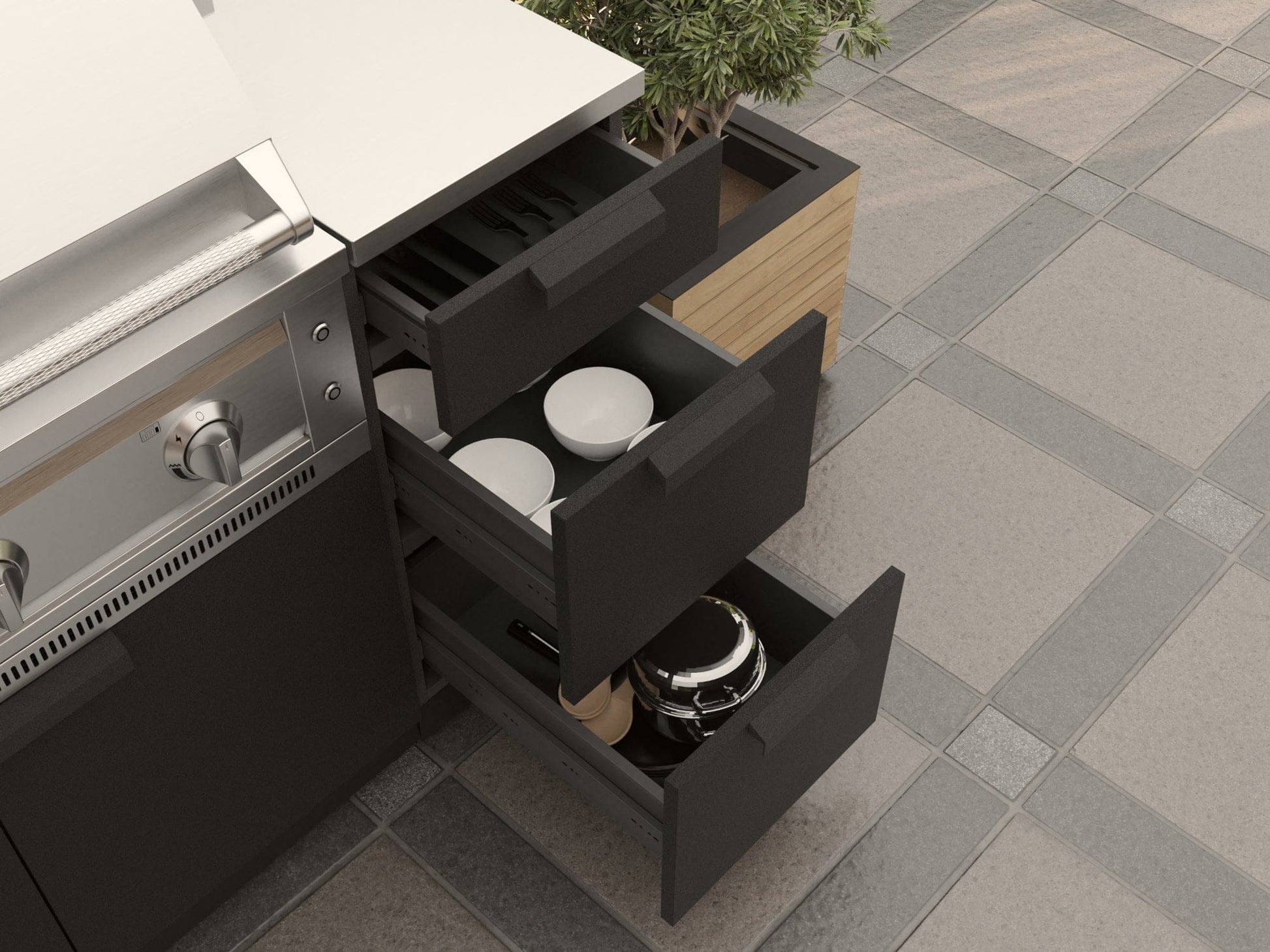 Three NewAge black outdoor kitchen cabinets open to reveal ample storage for utensils and cookware beside a sleek stove.