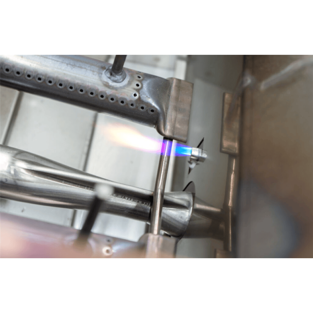 Premium built-in NG grill burner with vivid blue flame, ideal for luxury outdoor kitchens and industrial-style patios.