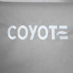 Gray fabric with white COYOTE lettering and wavy line, durable cover for outdoor grills.