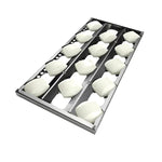 The Coyote metal ravioli mold tray with dough fits 30" gas grills—ideal for meal prep in premium outdoor kitchens.