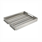 Coyote metal grill basket with slotted holes, ideal for charcoal grilling. Durable finish for outdoor kitchens.
