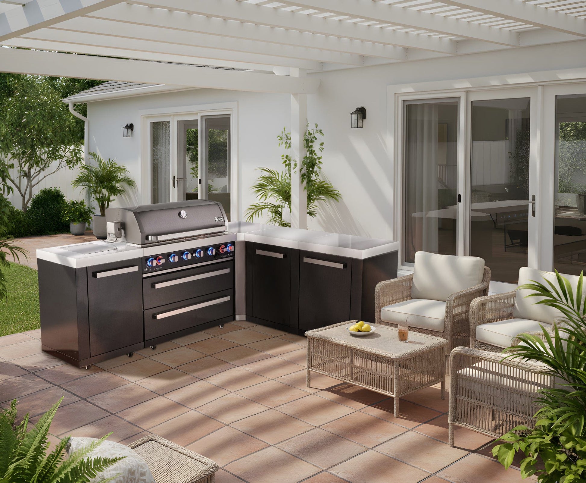 Premium patio with Mont Alpi black stainless steel grill, wicker seats, lush plants, and a white pergola.