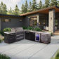 Mont Alpi outdoor kitchen with black stainless grill, built-in fridge, and modern patio setup by the house.