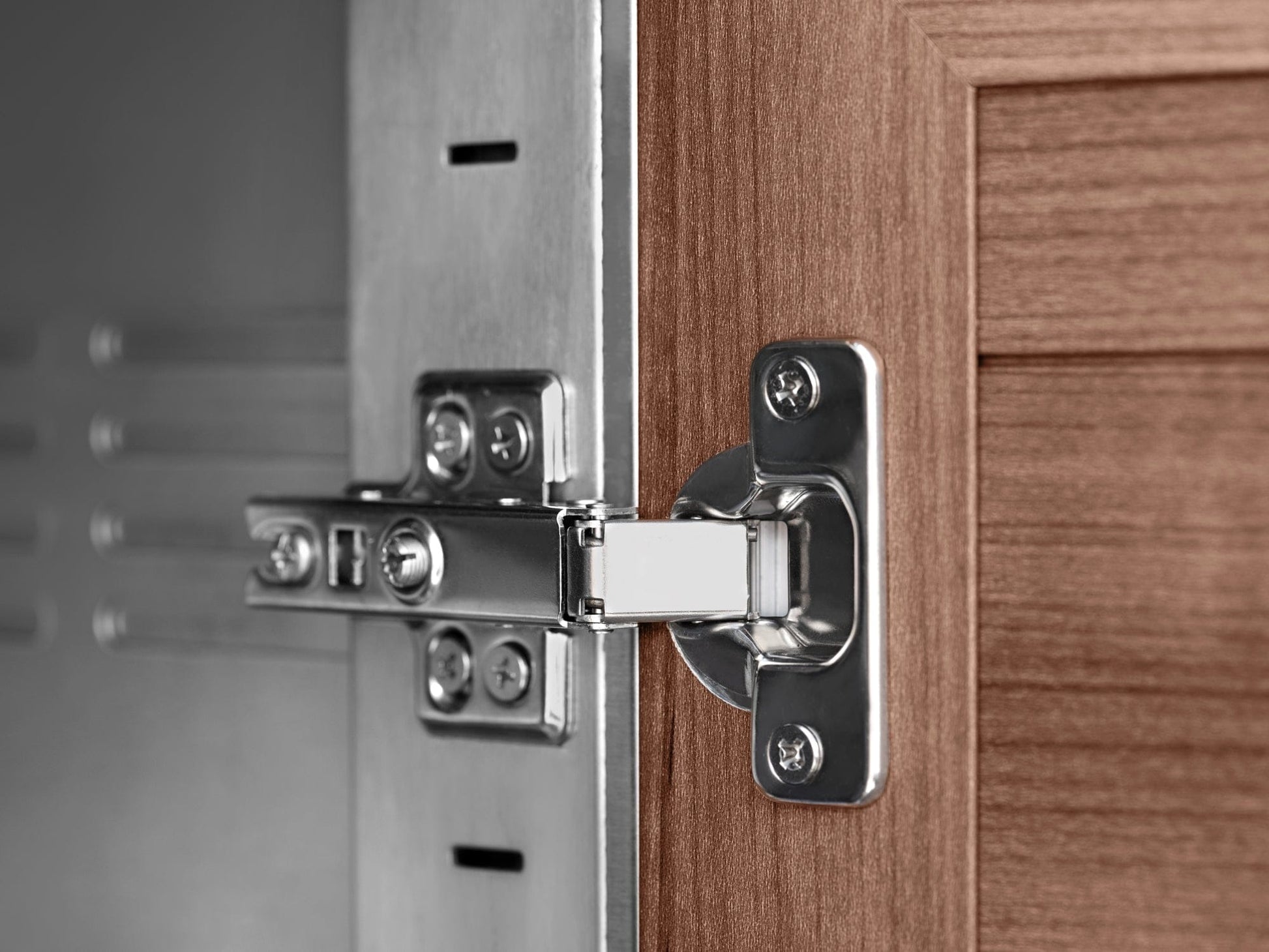 NewAge stainless hinge on wood, ideal for premium outdoor kitchens with durable finish and sleek design.