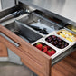Outdoor kitchen drawer open, showing fruit trays; stainless steel finish adds luxury to your outdoor space.