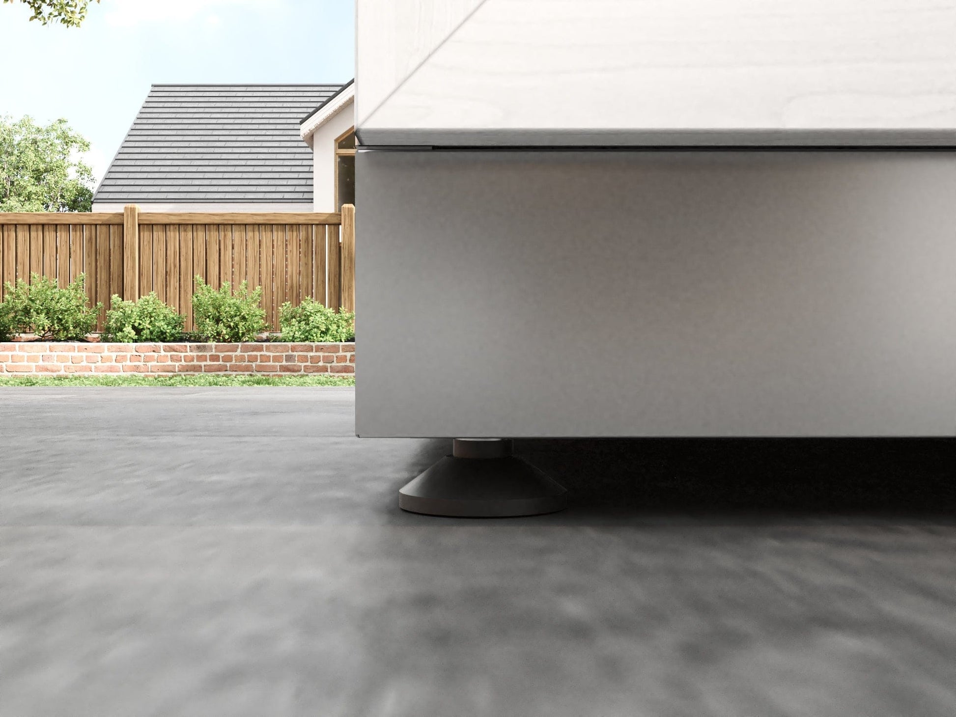 Sleek outdoor kitchen with gray finish and round base beside NewAge cabinets, featuring premium metal accents.
