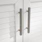 Sleek silver handles on white slatted doors, perfect for upscale modular outdoor kitchens with a durable finish.