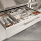 Modular drawer organizes utensils and spices; premium outdoor kitchen storage with sleek, weather-resistant finish.