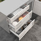 Sleek outdoor kitchen cabinets with three open drawers showing utensils, pots, and dishes; durable stainless steel finish.