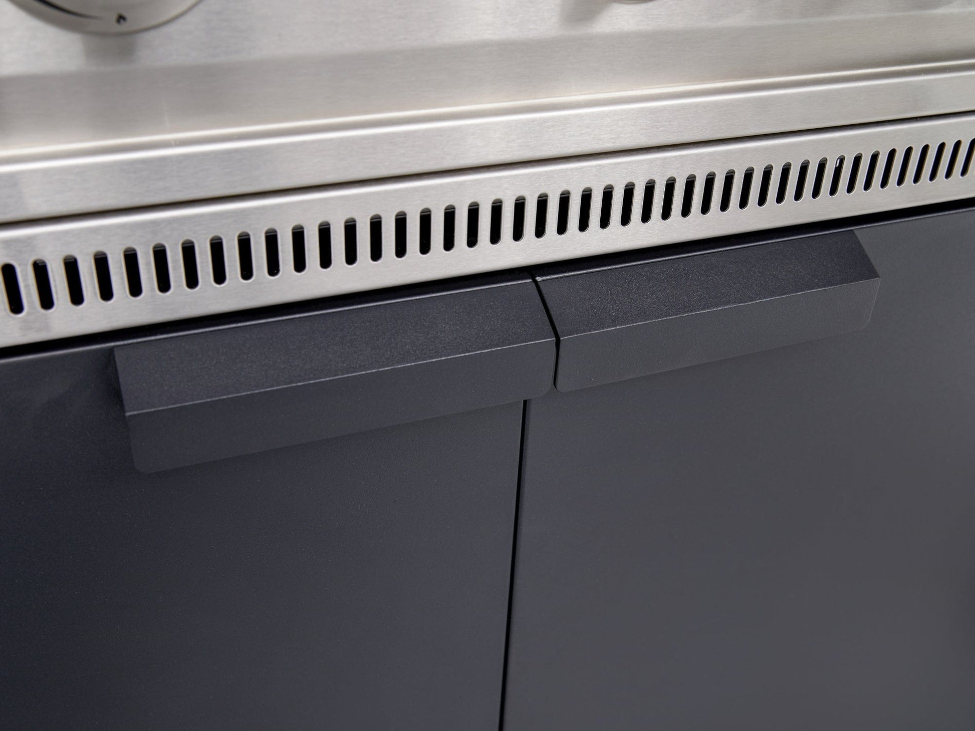 Stainless steel grill with modular outdoor kitchen, sleek black cabinets, and contemporary finish.