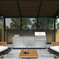 Premium outdoor kitchen with grill, sink, stainless steel cabinets, fridge, patio seating, and pergola.