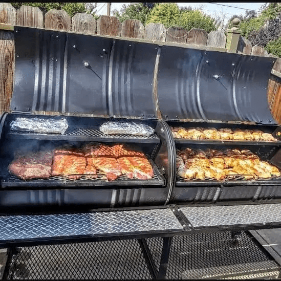 https://outdoorkitchenpro.com/cdn/shop/products/moss-grills-grill-moss-grills-tailgate-double-barrel-custom-bbq-grill-with-diamond-plate-countertops-205-31033656803484_1200x.png?v=1628306955